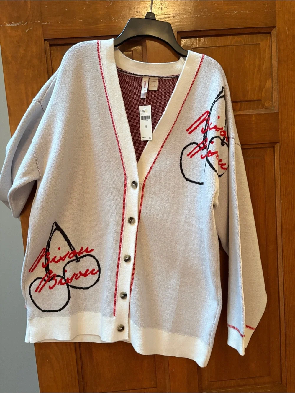 Anthropologie Cream Cardigan with Red Trim and Black Script Accents - Picture 3 of 4